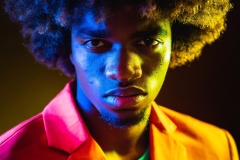 Firefly-bueatiful-black-man-with-afro-hair-dressed-in-geometric-complimental-color-clothing-photogr